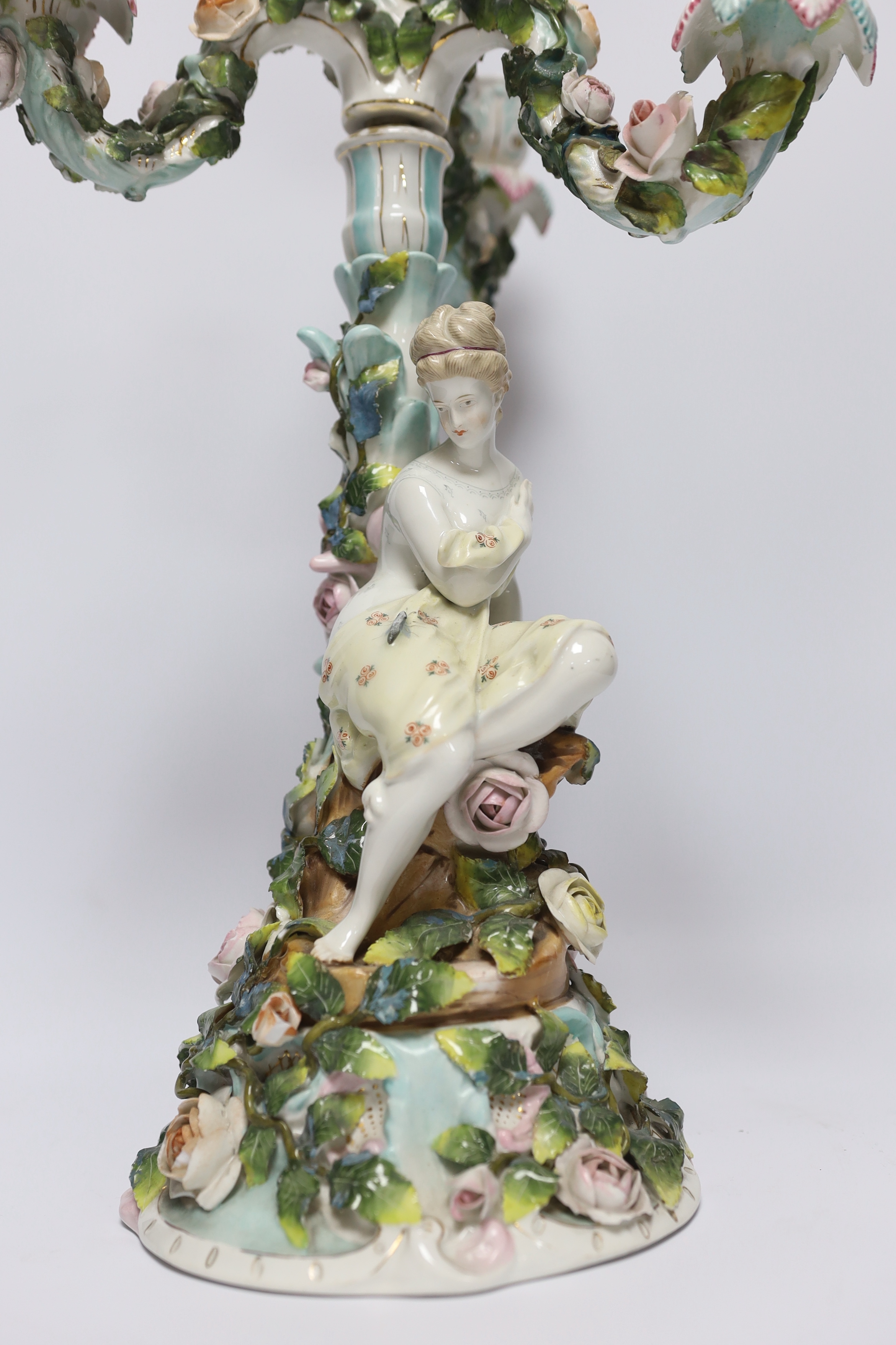 A 19th century Sitzendorf floral encrusted four light figural candelabra, 50cm